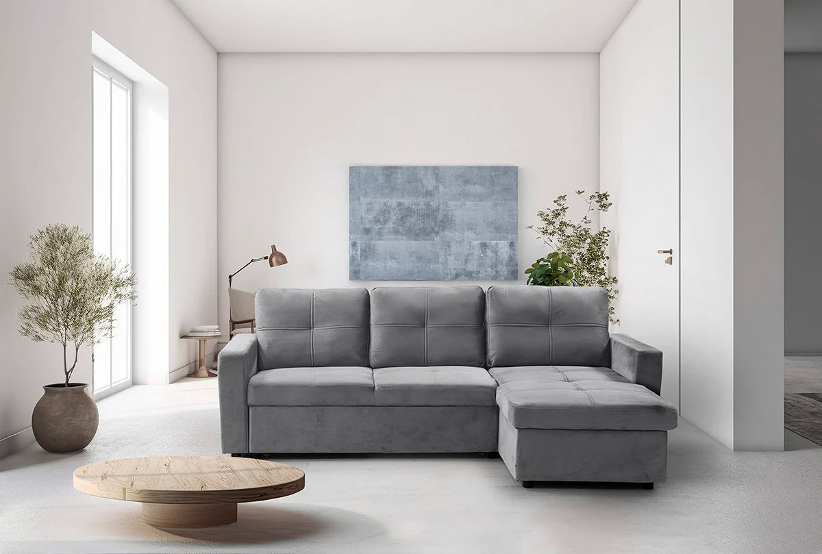 Sofá cama Pau gris con chaise longue en un salón luminoso