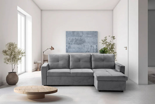 Sofá cama Pau gris con chaise longue en un salón luminoso